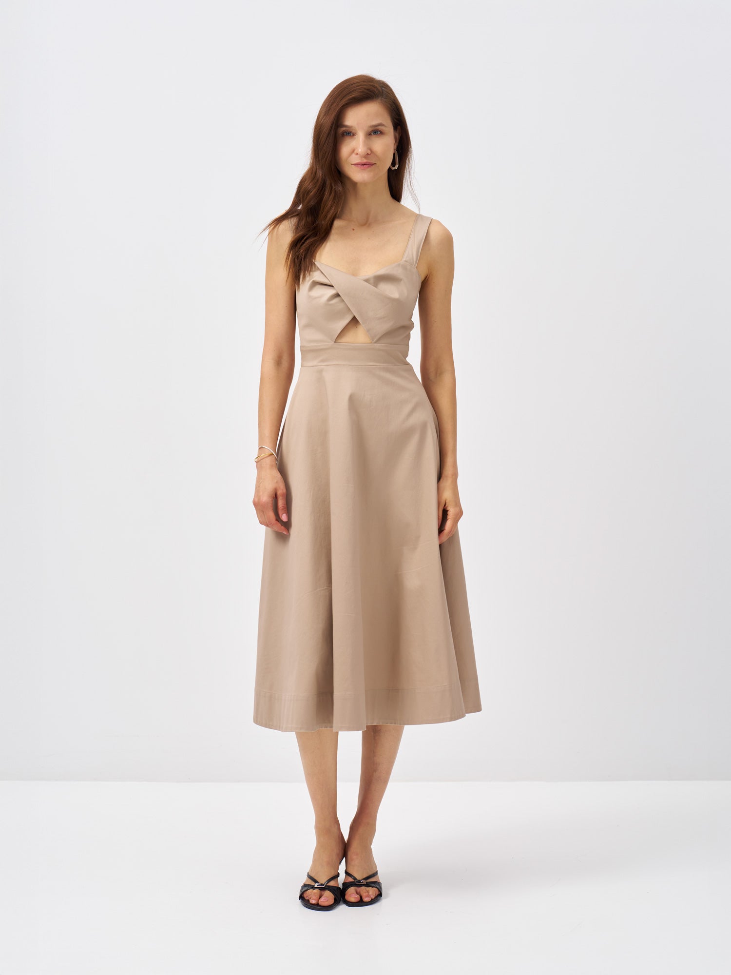Beige cotton satin midi dress with a folded crossover bodice, front cut-out detail and fitted waist.