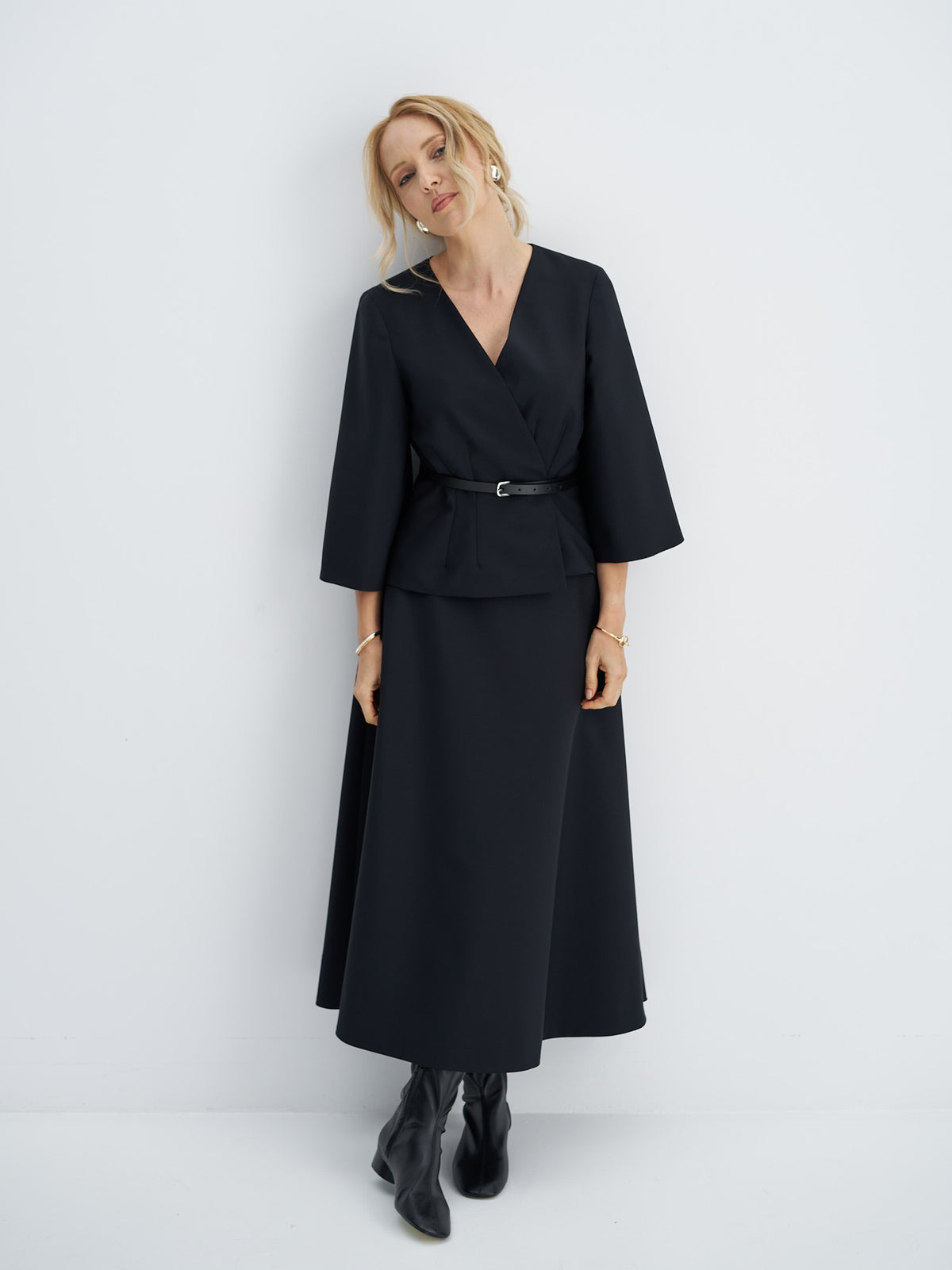 Front view of wool-mohair wrap jacket with a V-neckline, wide three-quarter sleeves and a narrow leather belt