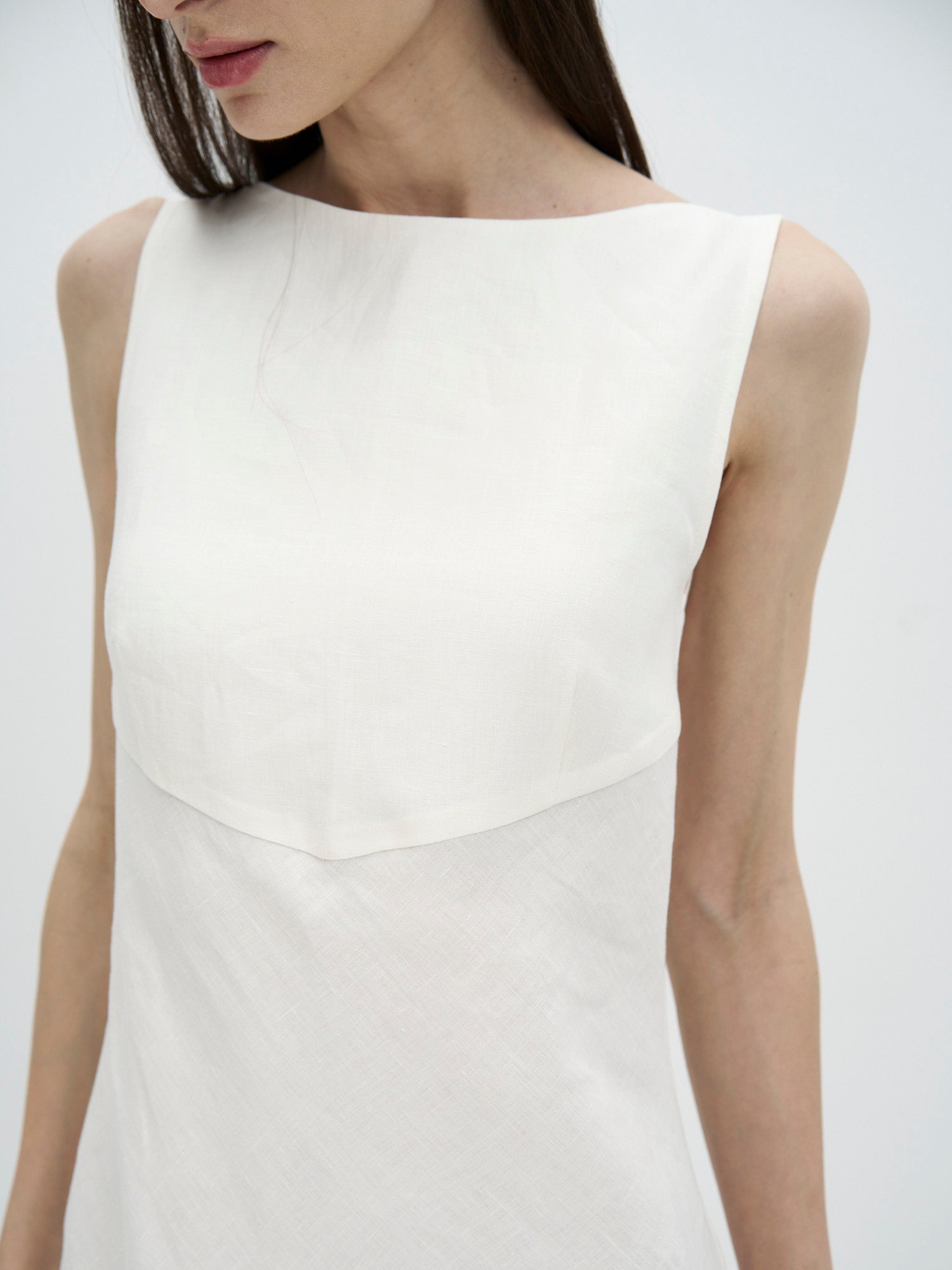 ivory boat neck linen dress with fluid silhouette