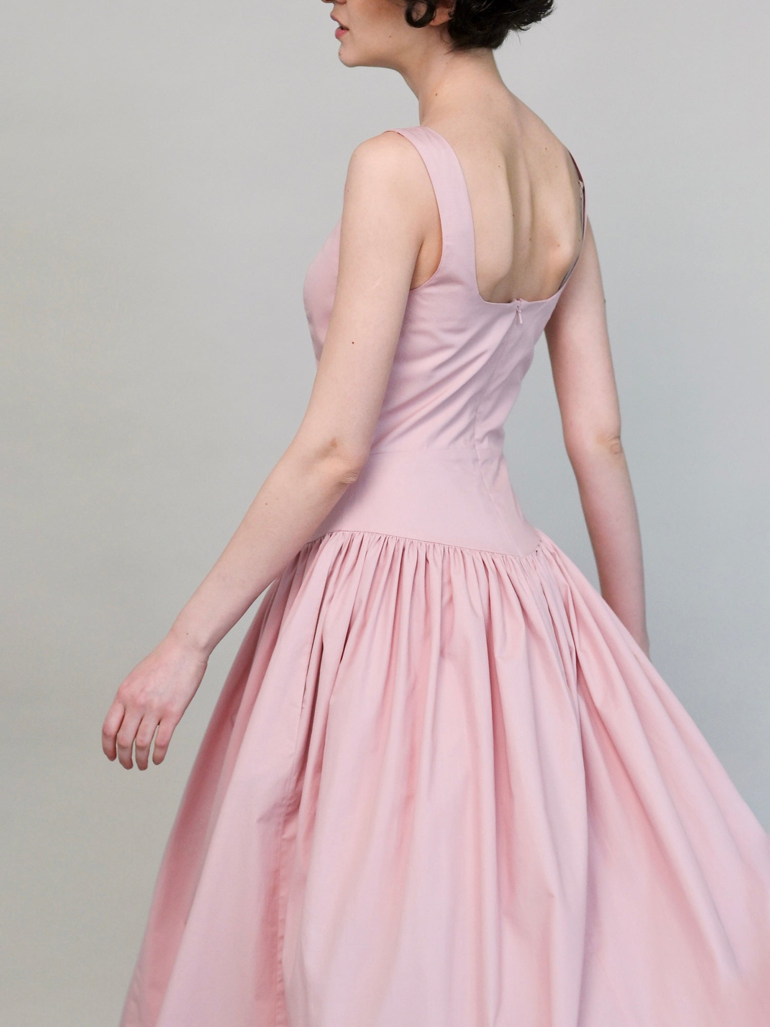 Full skirt movement, powder rose midi dress detail